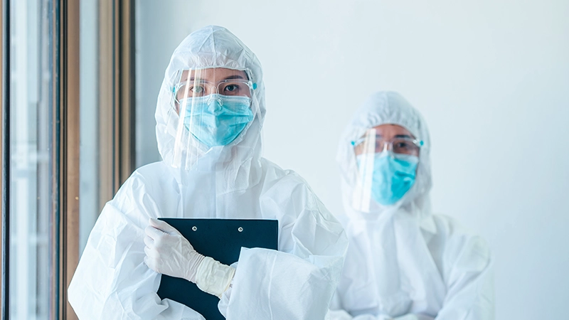 Medical staff and team in personal protective equipment or PPE working in during the epidemic crisis coronavirus.