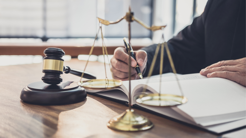 Lawyer or judge working in a courtroom.