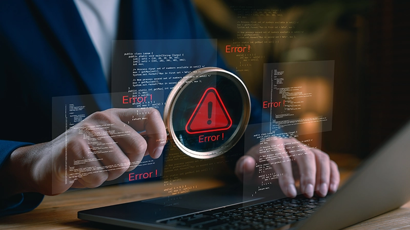 Debugging and error detection concept with programmer analyzing code on laptop.